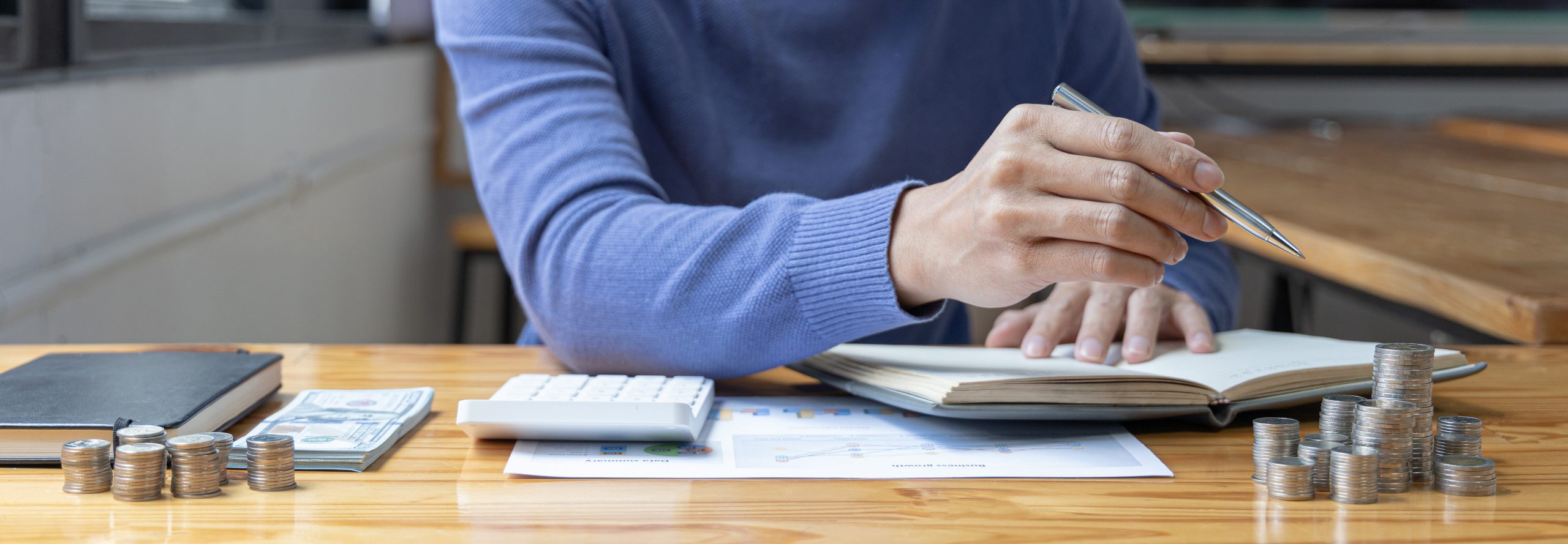 coins piled over bill managing your debt.